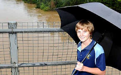Alex Turner checks out the rising Mary River at Kidd Bridge yesterday. Alex Turner checks out the rising Mary River at Kidd Bridge yesterday.